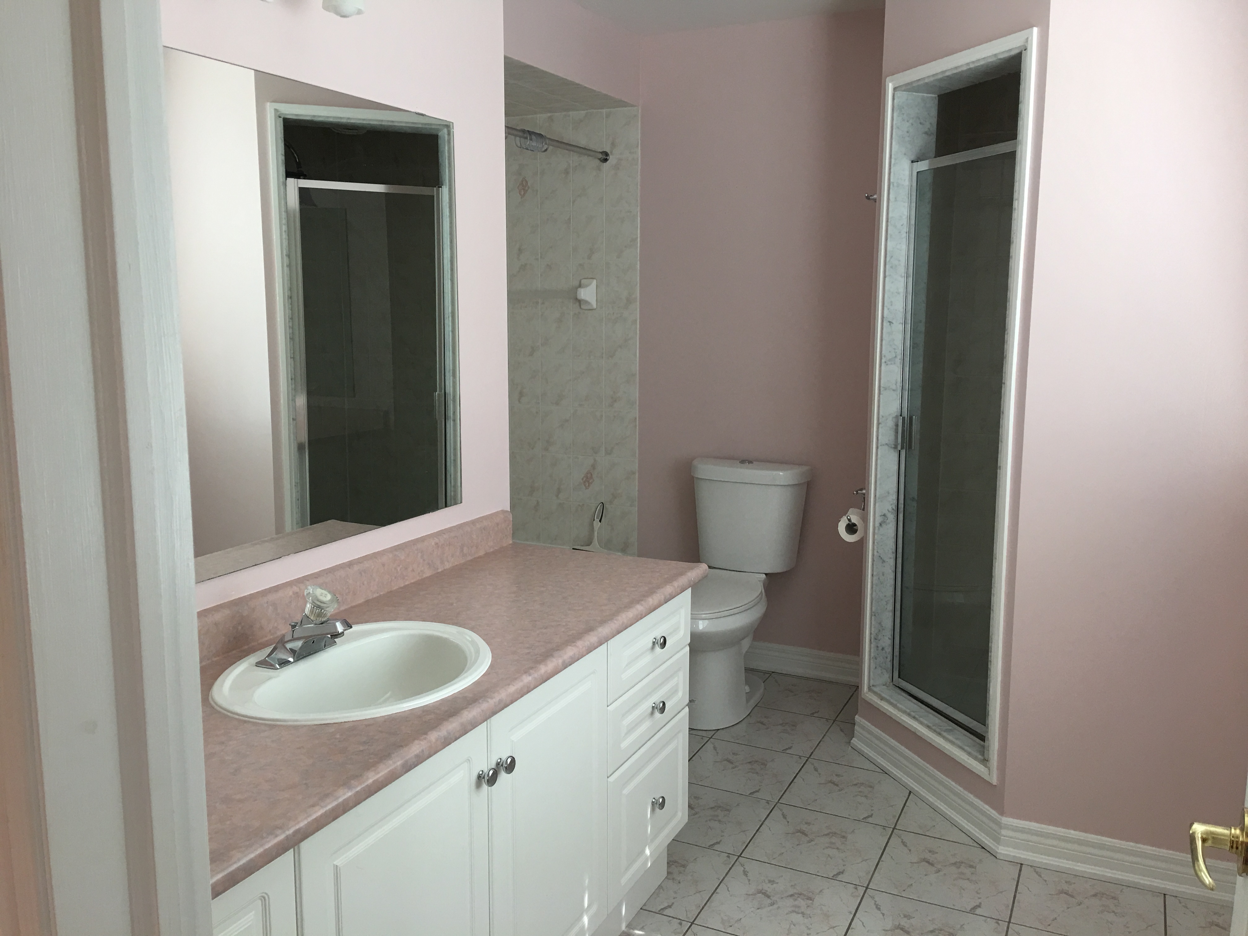 First floor master bedroom ensuite with both shower and bath tub